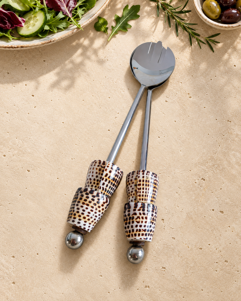 Silver-coloured salad serving set featuring patterned shell handles in cream, brown and black, with polished silver end beads, designed as The Esti.