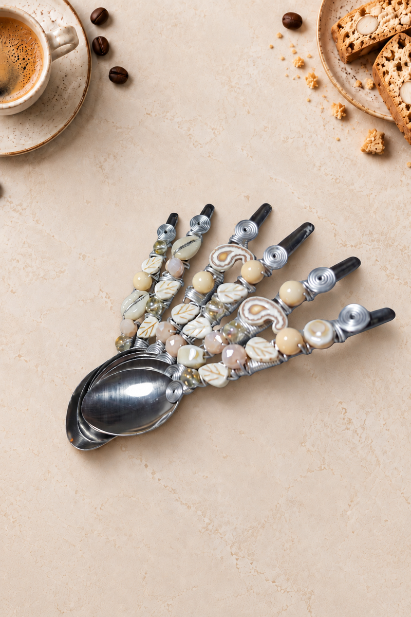 The Bahirun set of 6 decorative coffee spoons with silver-coloured spoon heads, cream and ivory beads, pearlescent accents and handcrafted silver wire detailing.