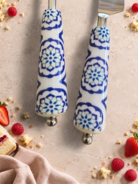 The Asri cake knife and server with blue and white patterned handles