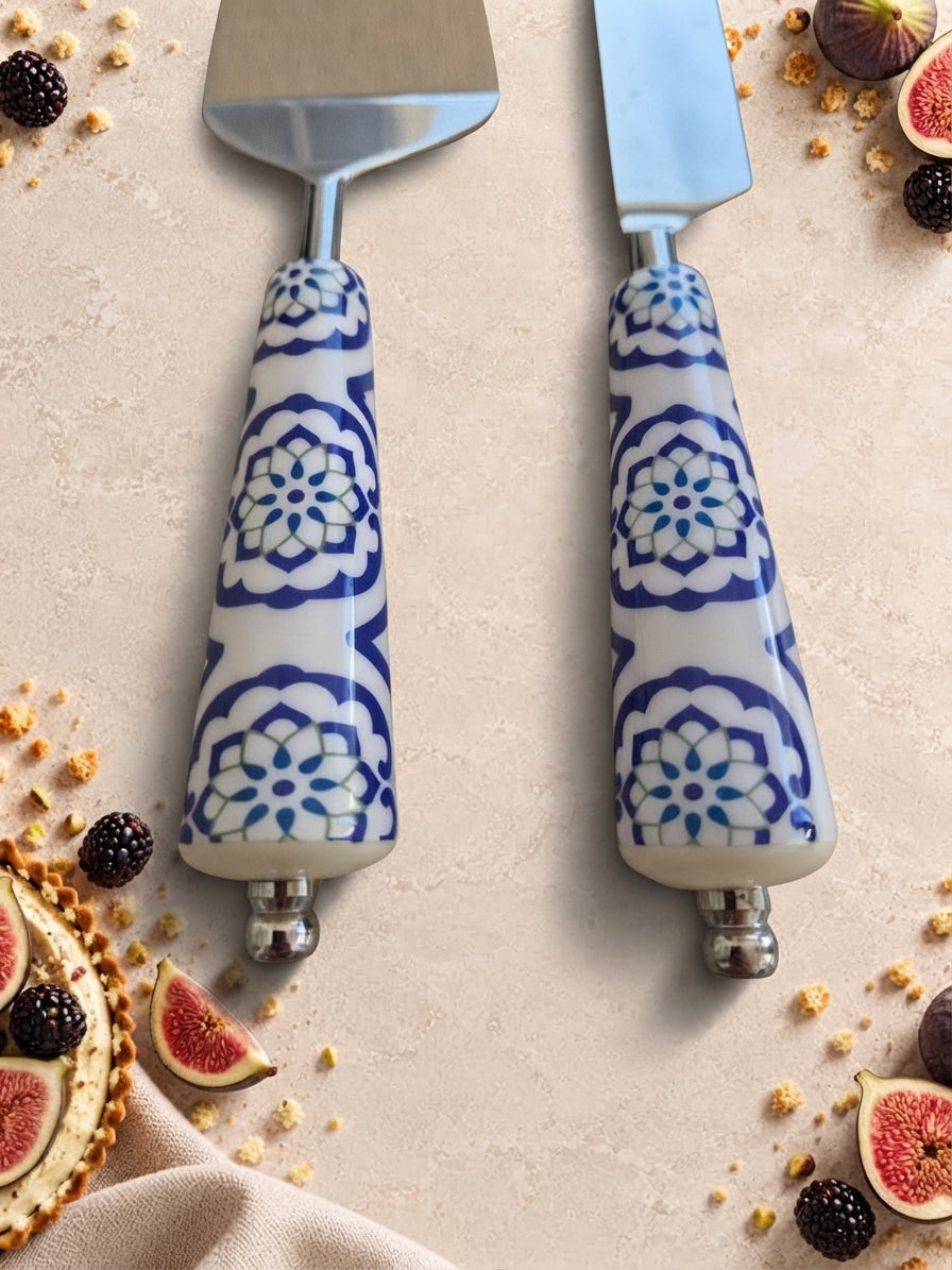 Close up of the blue and white patterned handles on the Asri cake knife and server