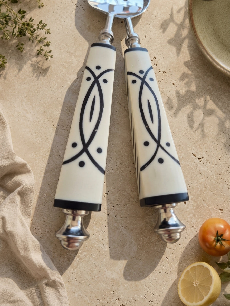 Close up of the white and black resin handles with silver stems, The Avani