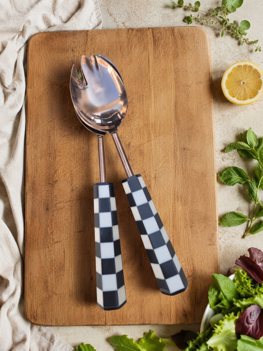 Black and white checkered salad servers with rose gold finish, the Azara