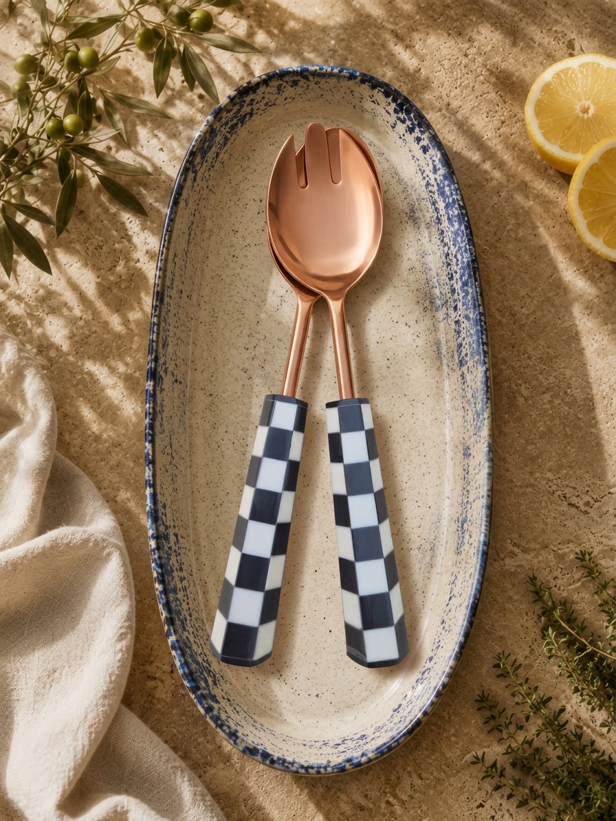 Rose gold salad spoon and fork with black and white handles, the Azara serving set