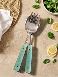 The Calia salad serving set with silver heads and jade green marbled handles