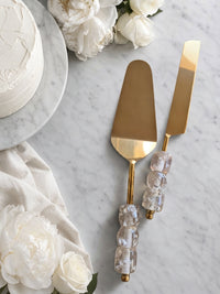 Gold cake knife and server with transparent beaded handles, the Embun serving set
