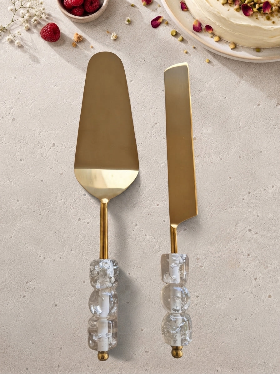 The EMBUN Cake Serving Set by Zapurah with clear beaded handles and gold finish