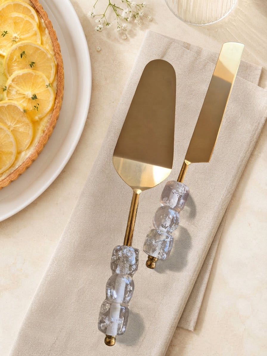 The Embun gold cake knife and server with clear faceted beads