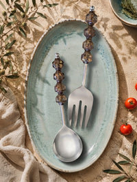 The Kalina salad serving spoon and fork with silver heads and smoky brown beaded handles with golden flecks