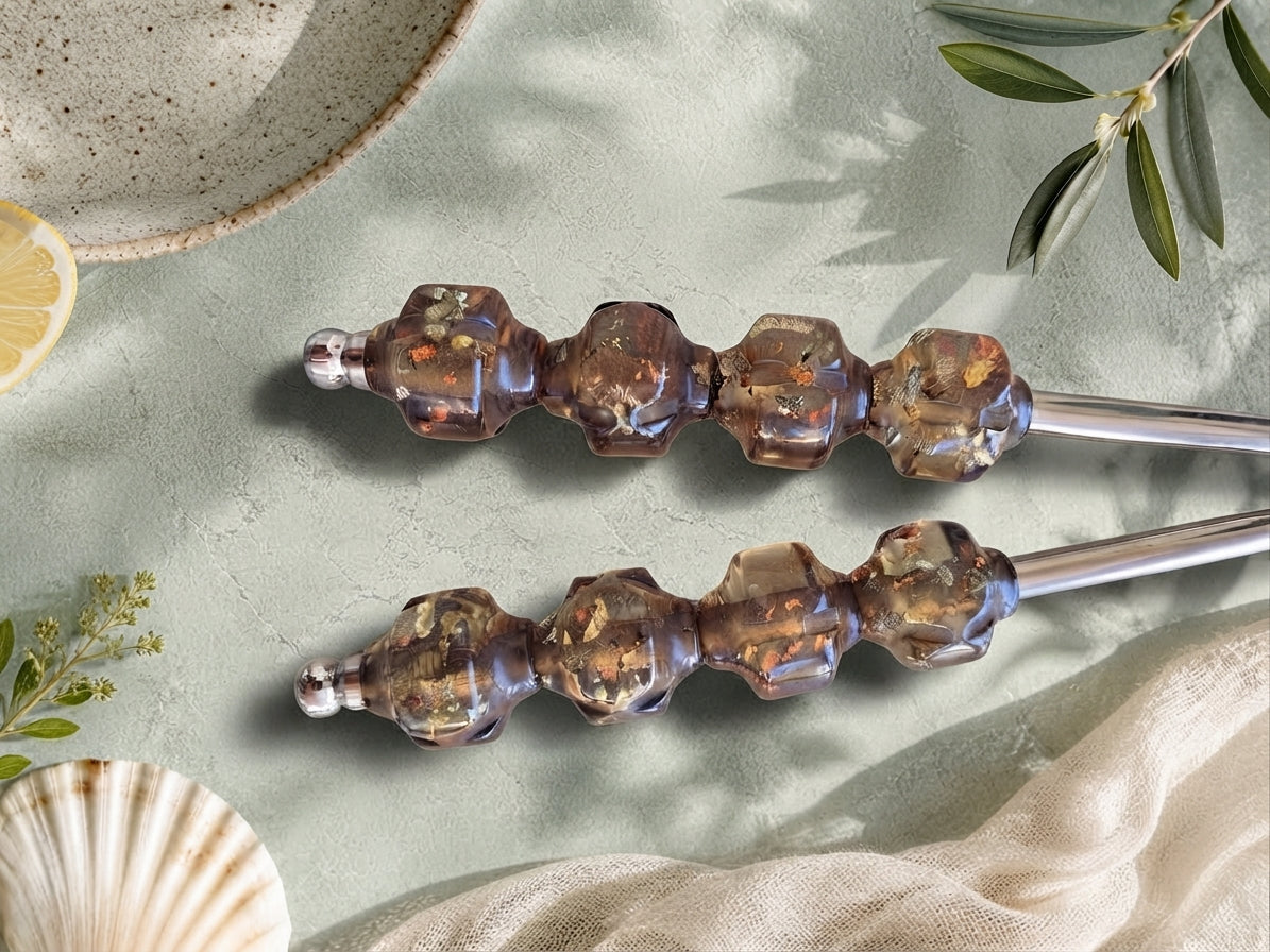 Close up of the translucent smoky brown beaded handles with silver stems, The Kalina