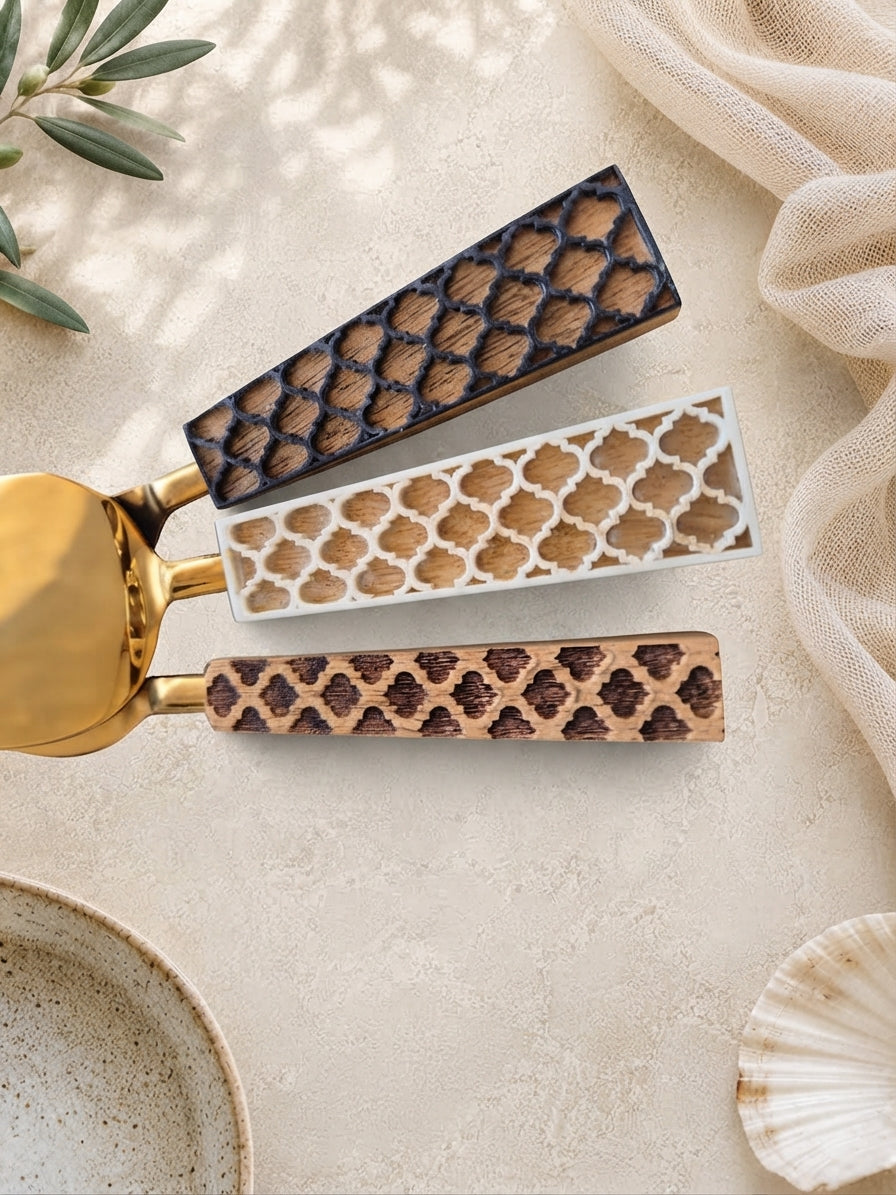 Detail of the brown, ivory and dark brown patterned handles on The Kartika cheese knife set