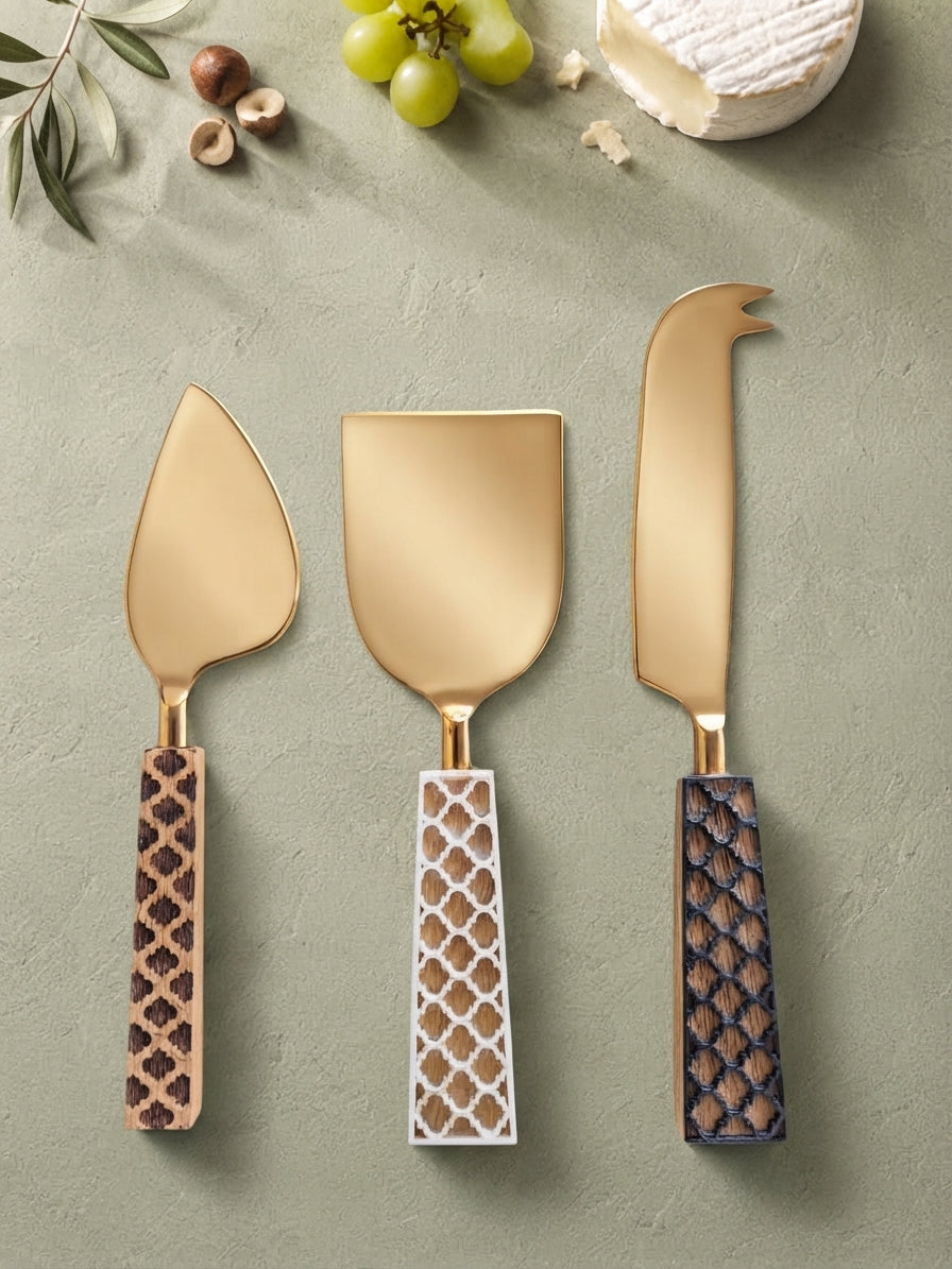 The Kartika Cheese Knife Set by Zapurah with animal print handles and gold finish