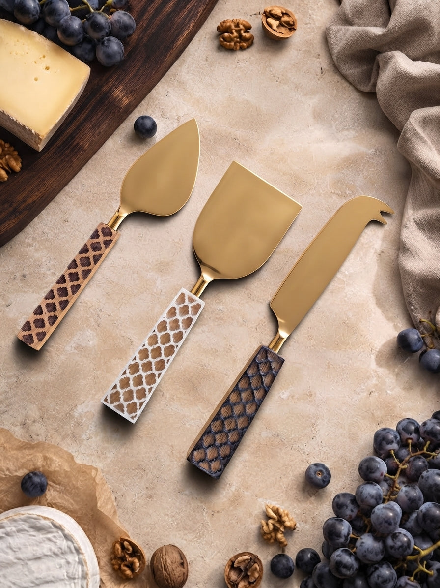 Gold cheese knives with mixed brown, ivory and dark brown handles, the Kartika cheese knife set