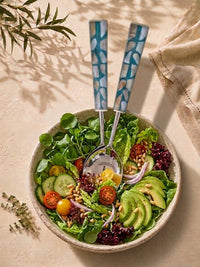 The Laraya salad serving spoon and fork with silver heads and turquoise, white and beige mosaic handles
