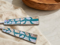 Detail of the turquoise, white and beige mosaic handles on The Laraya salad serving set