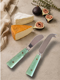 The Maraya cheese knife set with silver metalwork and jade green marbled handles