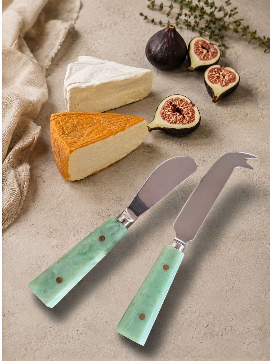 The Maraya cheese knife set with silver metalwork and jade green marbled handles