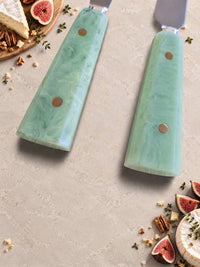 Detail of the jade green resin handles on The Maraya cheese knife set