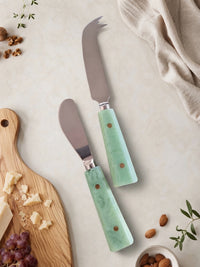 Cheese knives with silver heads and jade green marbled handles from The Maraya