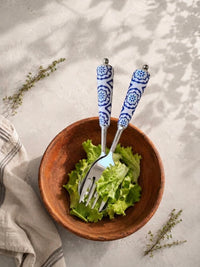 Salad serving spoon and fork with silver heads and blue and white decorative handles, The Ravina