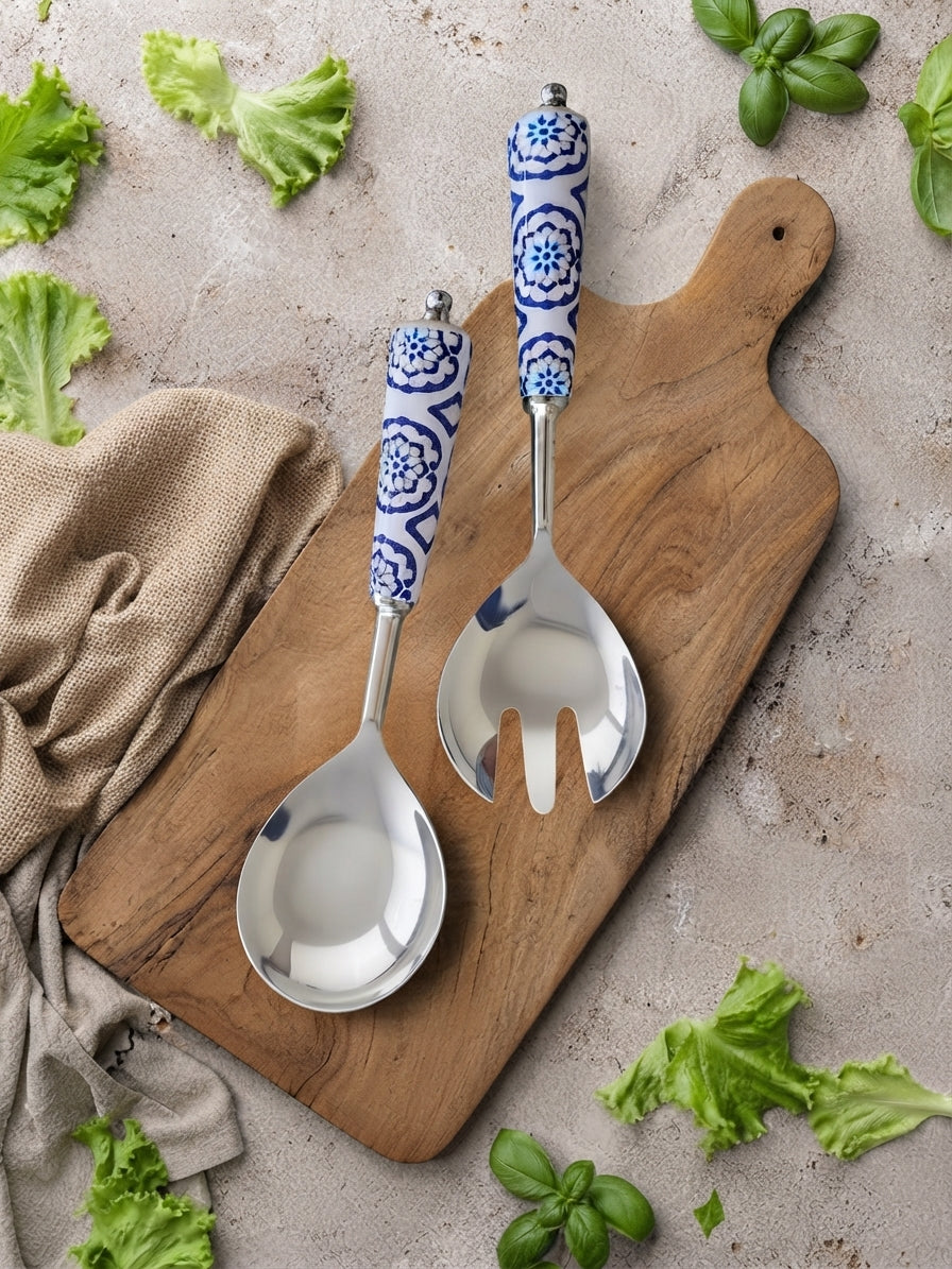 The Ravina salad serving spoon and fork with silver heads and blue and white patterned handles