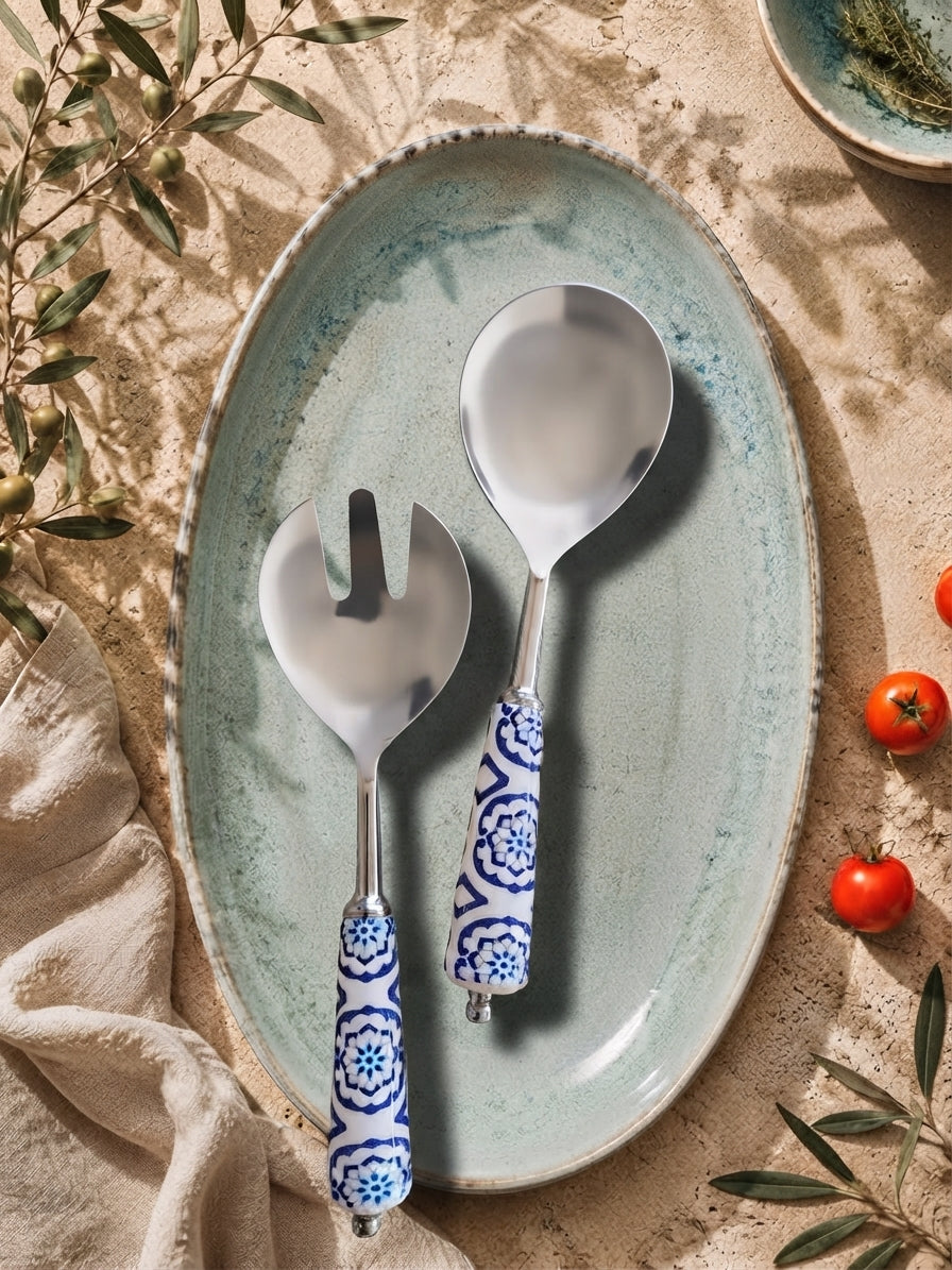 Salad serving spoon and fork with silver heads and blue and white patterned handles from The Ravina