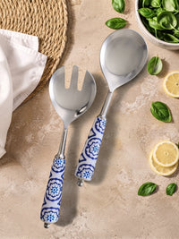 The Ravina salad spoon and fork with silver heads and blue and white ceramic style handles