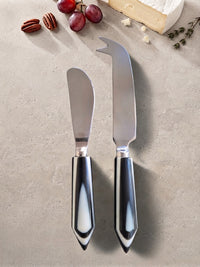 The Rona Cheese Knife Set by Zapurah with glossy black and white resin handles and silver finish