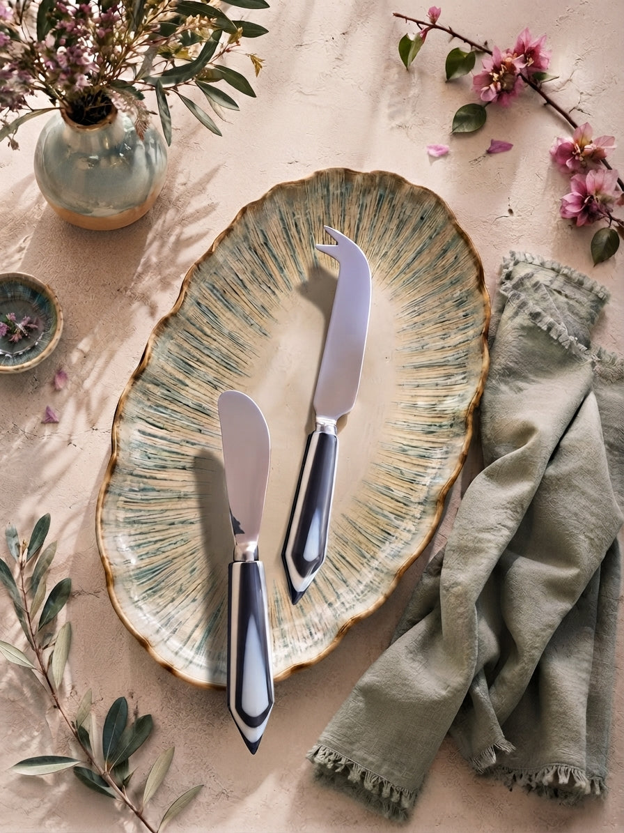 Silver cheese knives with black and white resin handles, the Rona cheese knife set