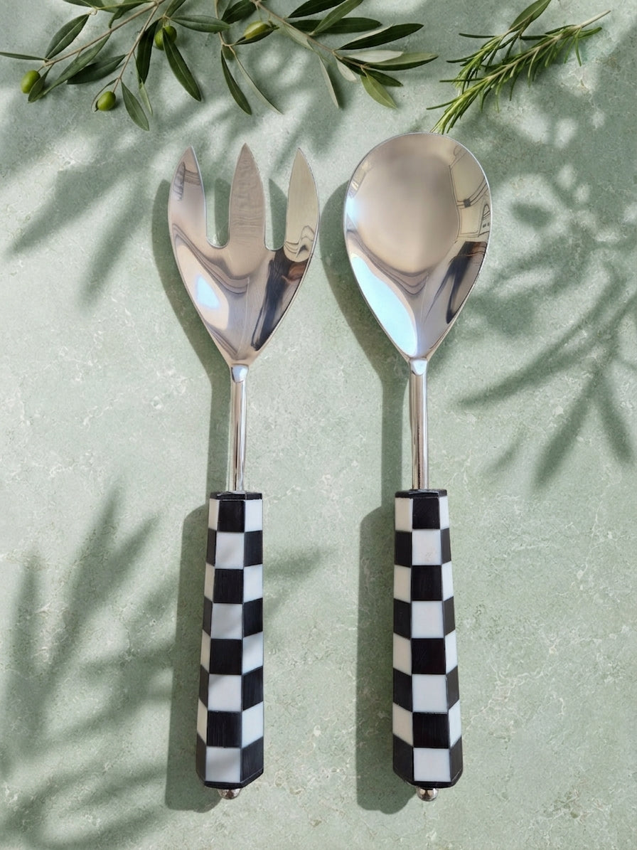 The Talisa Salad Servers by Zapurah with black and white checkerboard resin handles and silver finish