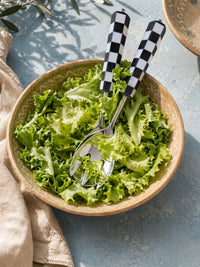 Salad serving spoon and fork with silver heads and black and white checkerboard handles from The Talisa