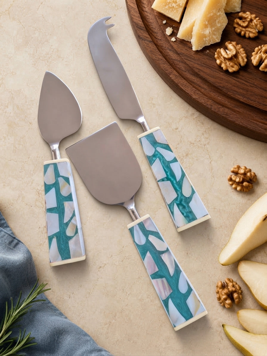 Silver cheese knives with turquoise, white and beige mosaic handles, the Teratai cheese knife set