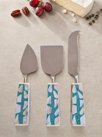 The Teratai Cheese Knife Set by Zapurah with turquoise mosaic-style handles and silver finish
