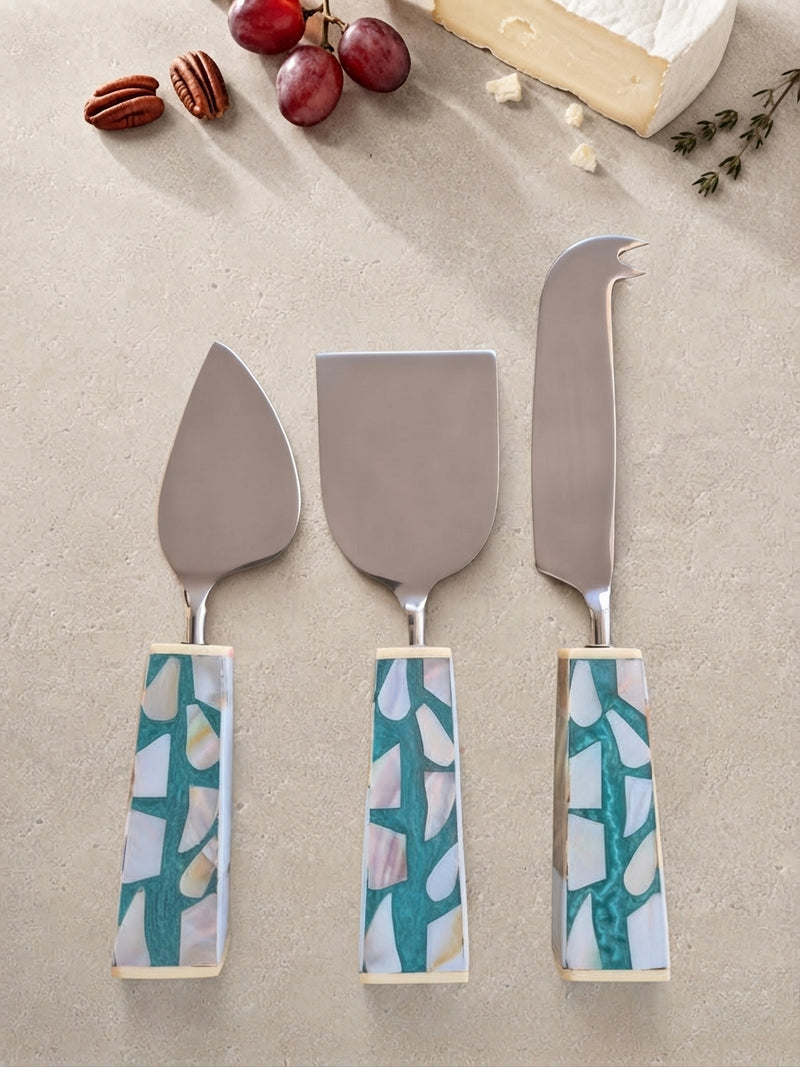 The Teratai Cheese Knife Set by Zapurah with turquoise mosaic-style handles and silver finish
